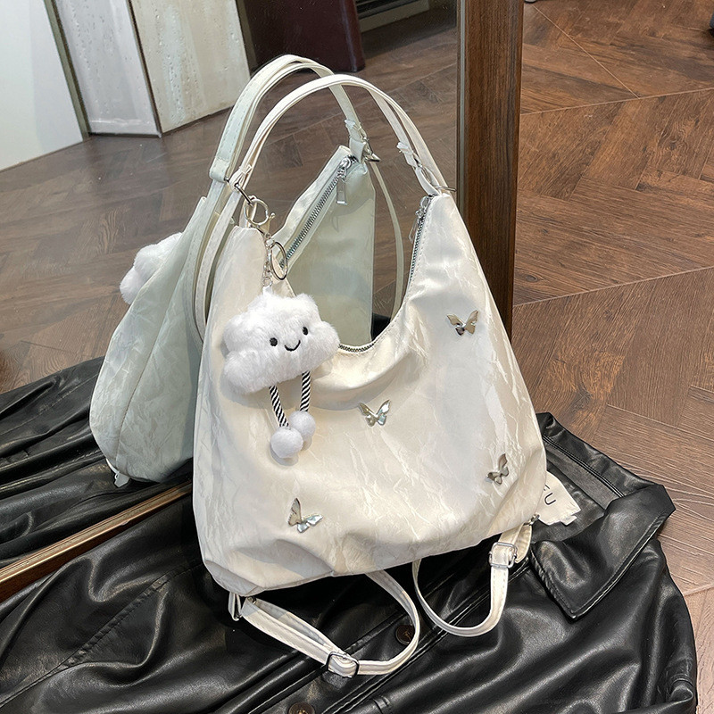 Bolsa de grande capacidade feminina 2026 Cross-Border novo estilo nicho Design Commuter multifuncional ombro duplo um @