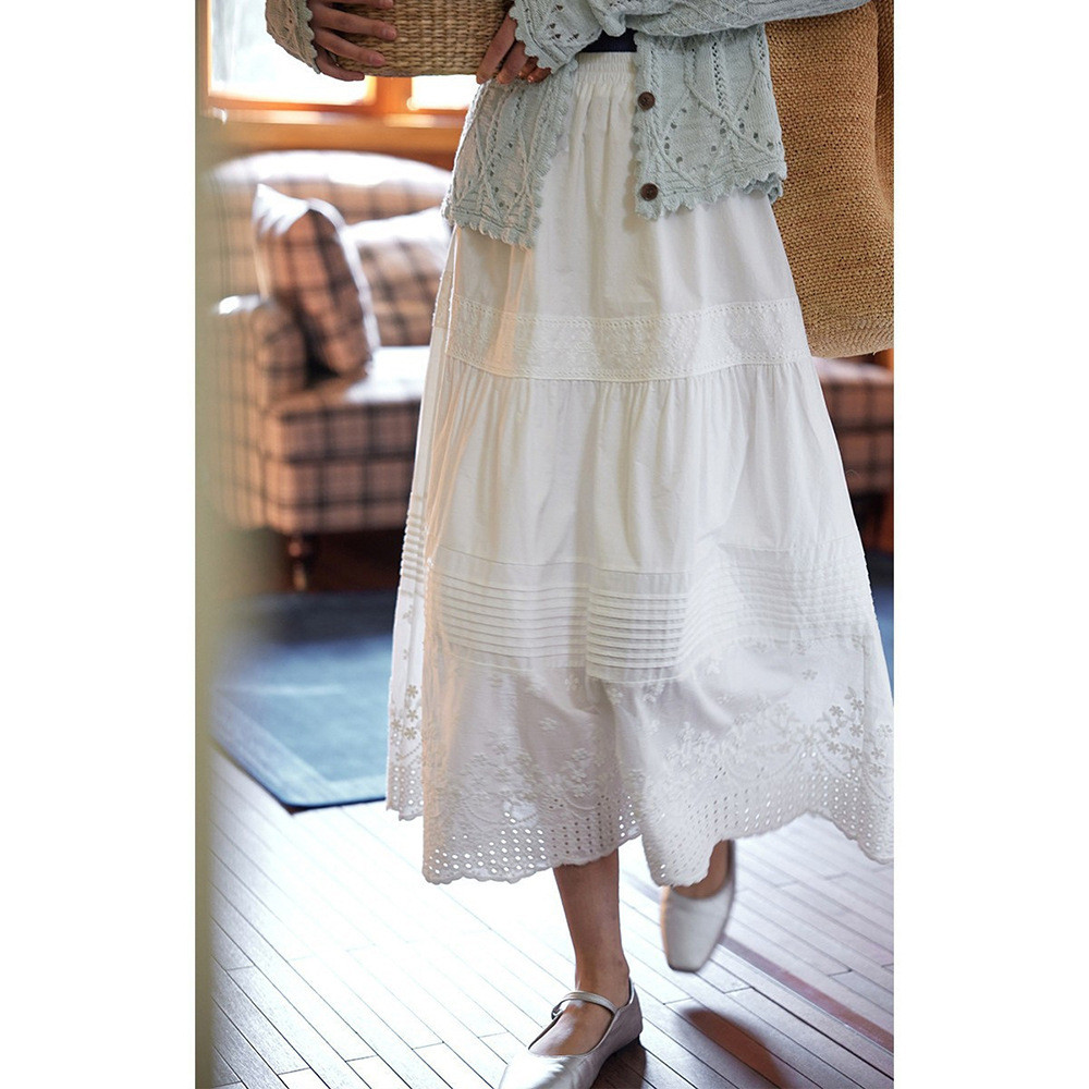 White cotton-linen skirt with elaborate embroidery, elastic waist, and hollow lace design for women, spring and summer