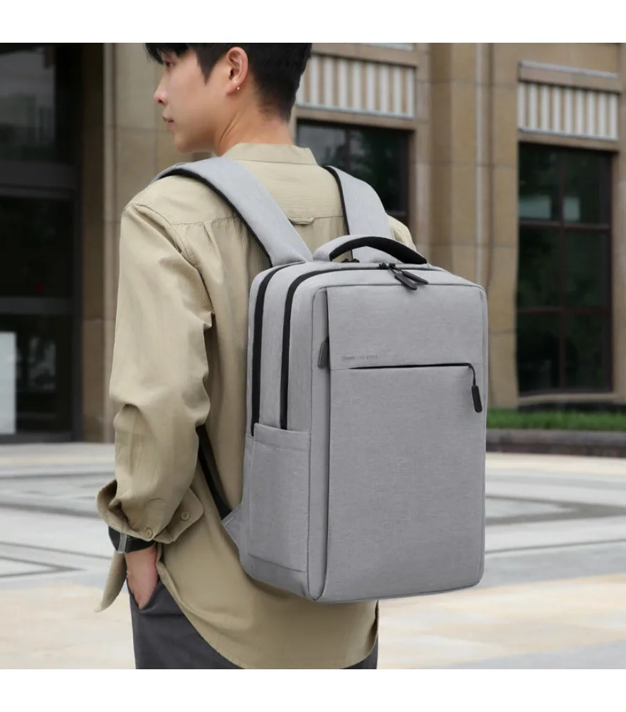Black fine striped laptop backpack with printed brand logo front horizontal zipper pocket anti splash side built in USB