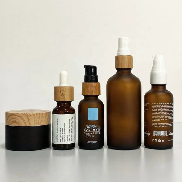 100ml frosted amber glass spray bottles cosmetic packaging eco bamboo lotion bottle with shampoo pump bamboo cap cbd