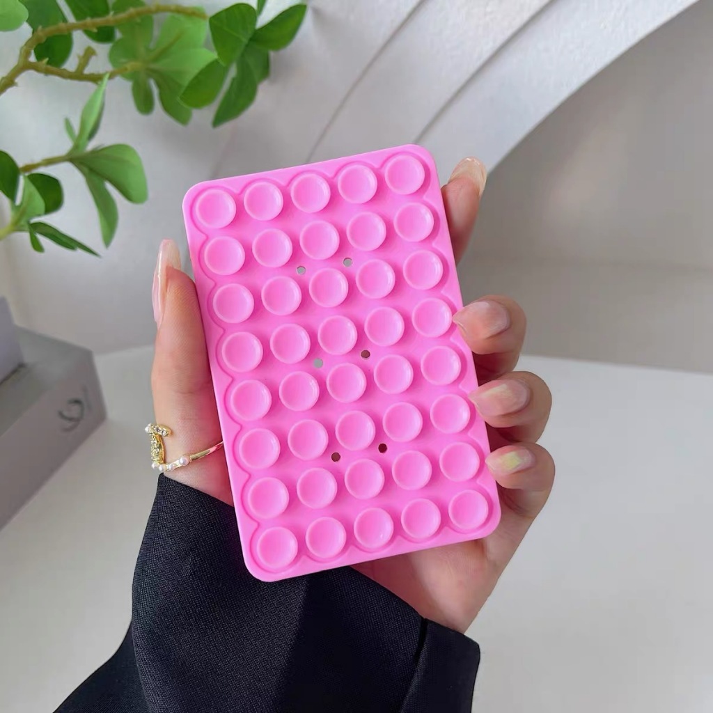 Suporte Adesivo Premium com Ventosas GRNANDE para Celular – Silicone Antiderrapante, Fixação Forte e Cores Vibrantes