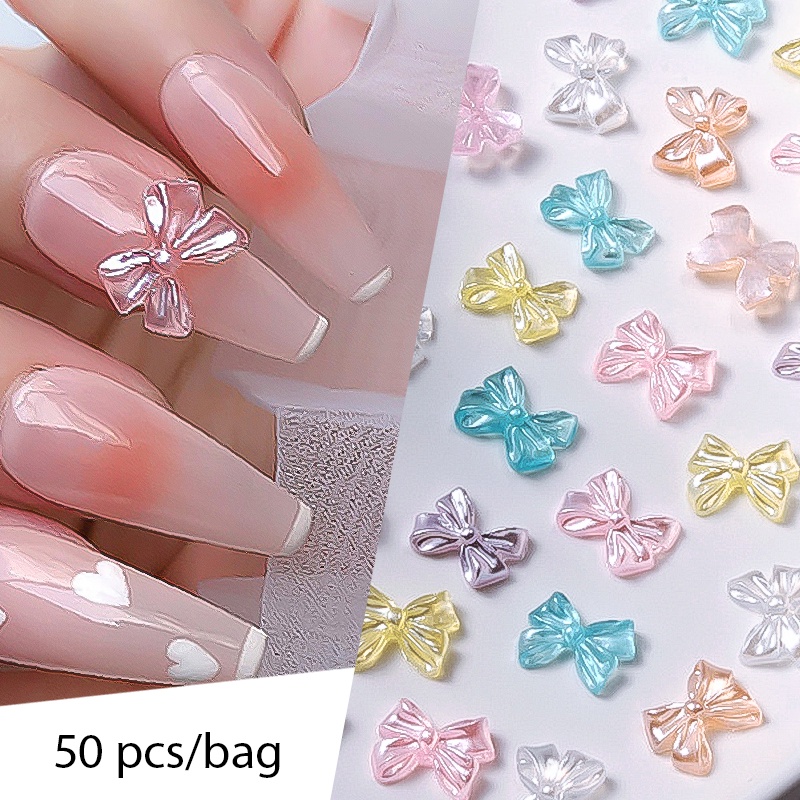 50Pcs/Bag Resina De Nó De Arco Auroras Rose Flower Nail Charm Parts 3D Branco Flatback Rhinestones Art Decoração Manicure Acessórios De DIY