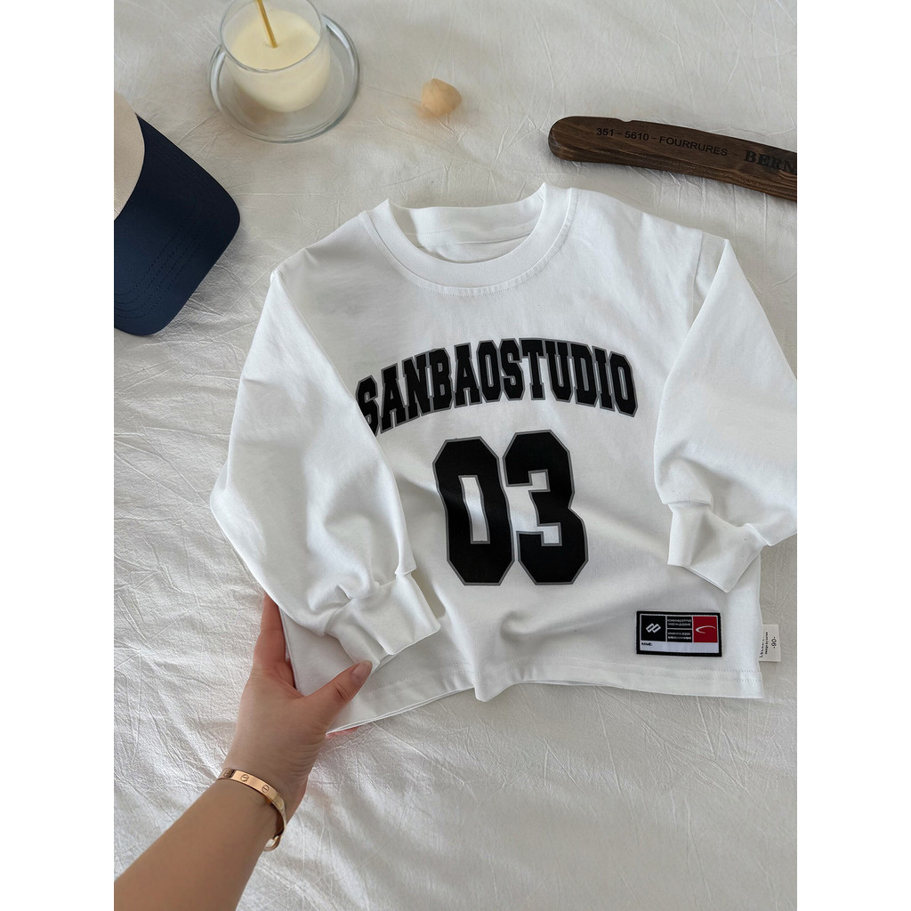 Camiseta infantil de manga comprida roupas de primavera 2026 novo estilo infantil carta branca topo moda bebê puro algod
