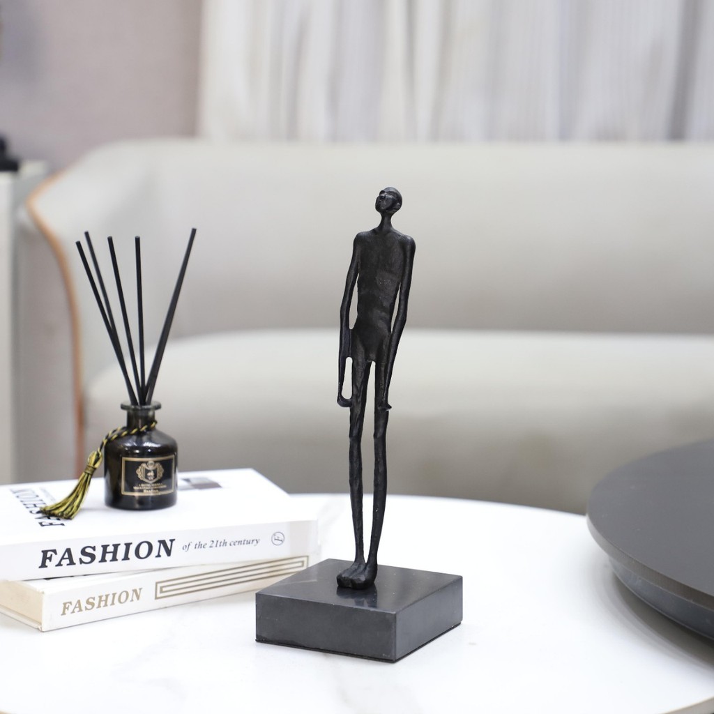 TVGN Modern minimalist abstract cast iron sculpture of a person gazing upwards, suitable as a decorative piece for livin