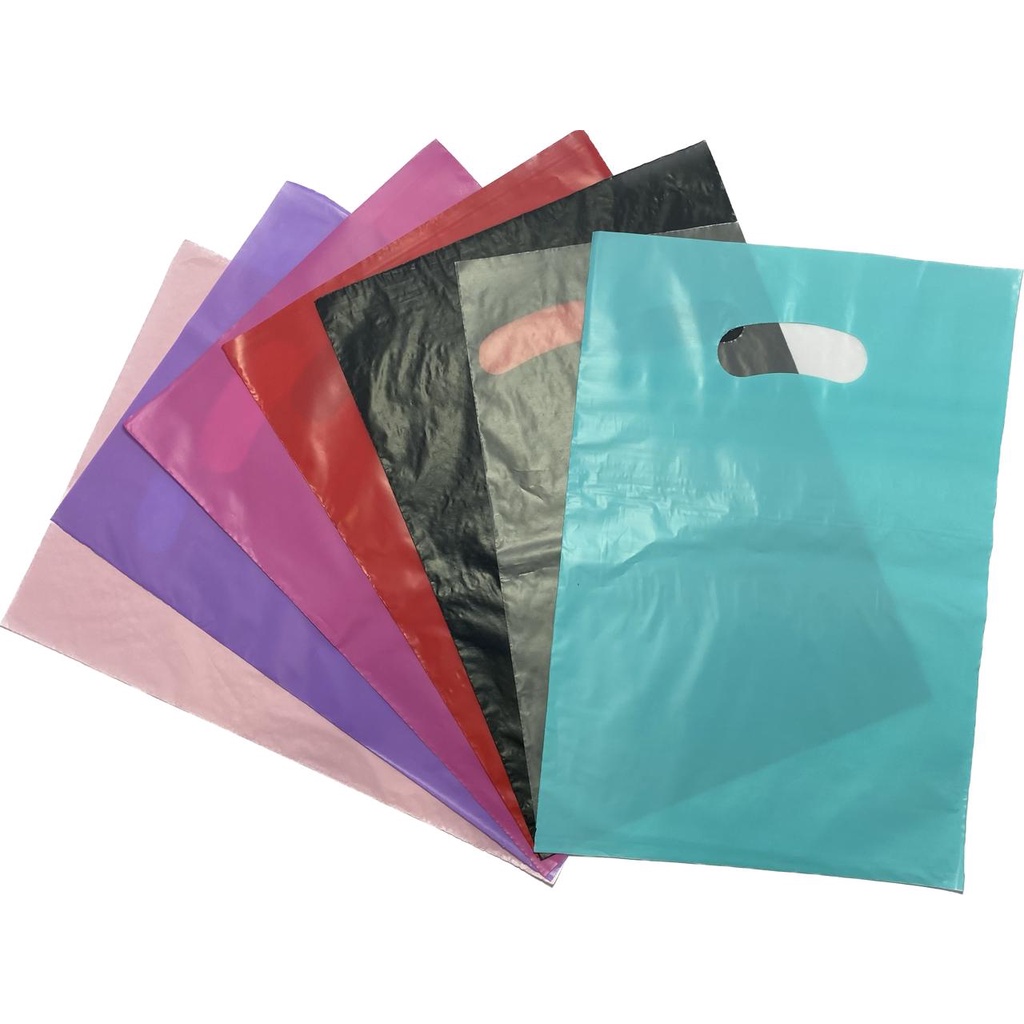 50 Sacolas Plásticas -25x35 -Material Virgem -alça Vazada Boca De Palhaço Para Loja - 0,08 Micras