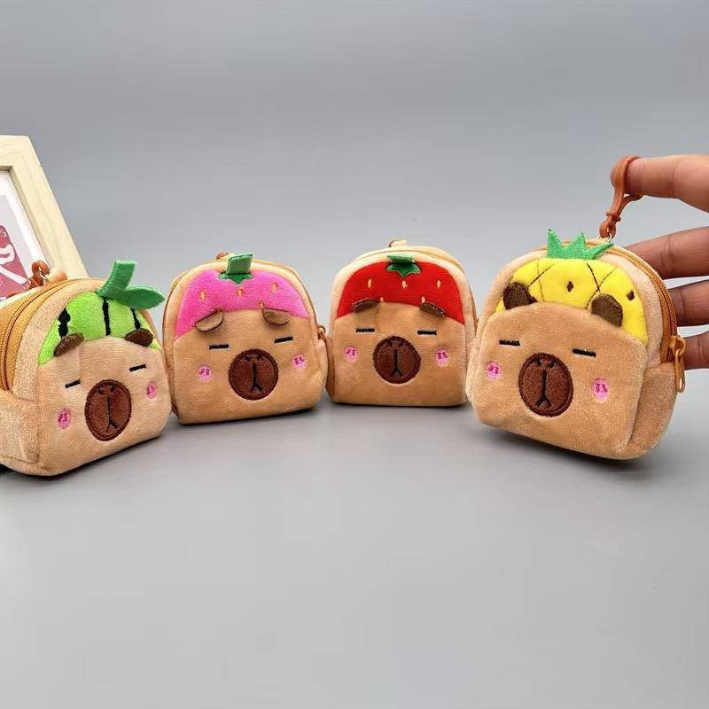 2024Capybara cartoon coin purse plush coin purse earphone-style storage bag，Suitable for girls to use。