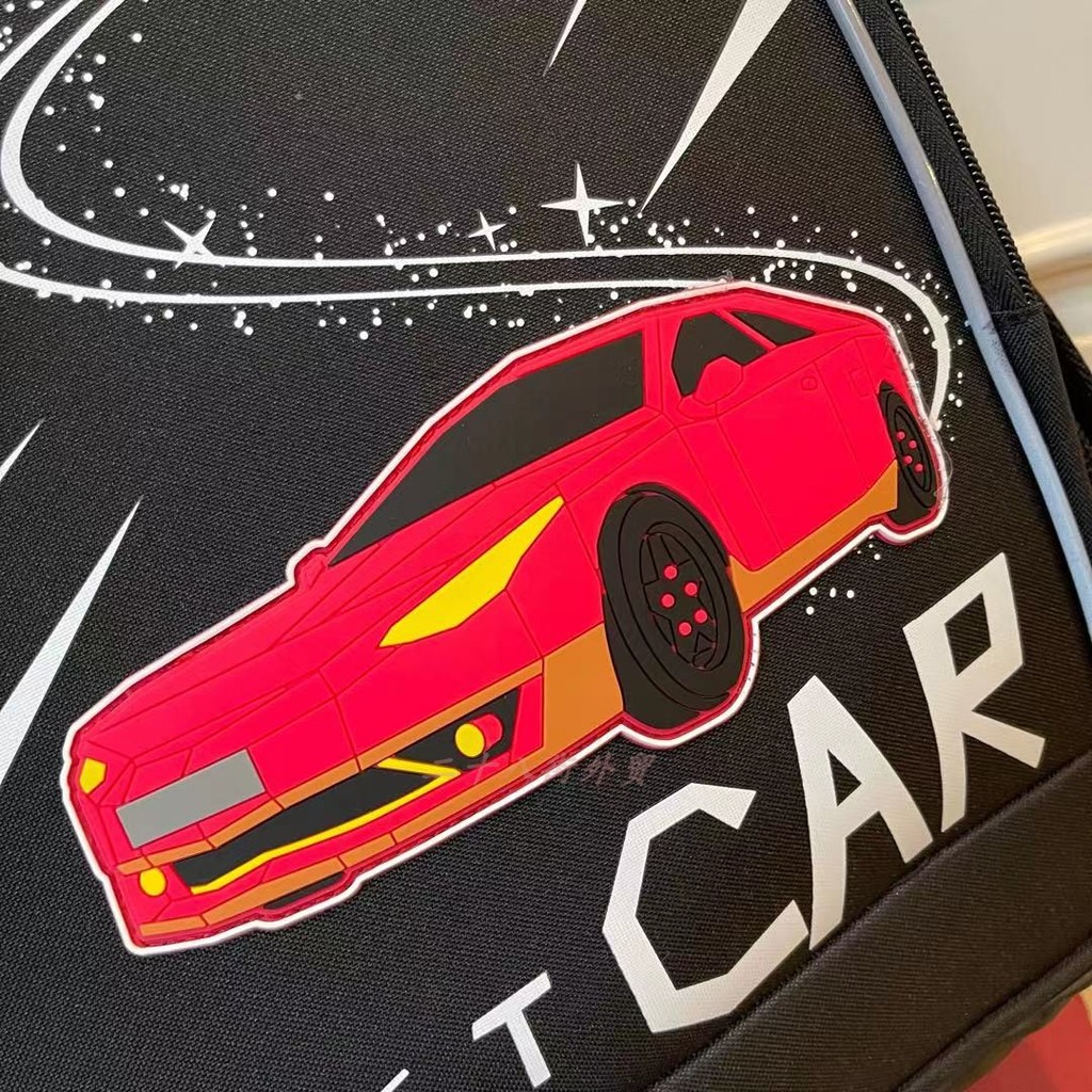 Limpeza de estoque Bem-estar Correndo Volume Cool Sports Car Boy Schoolbag Alunos da escola primária Versão coreana da s