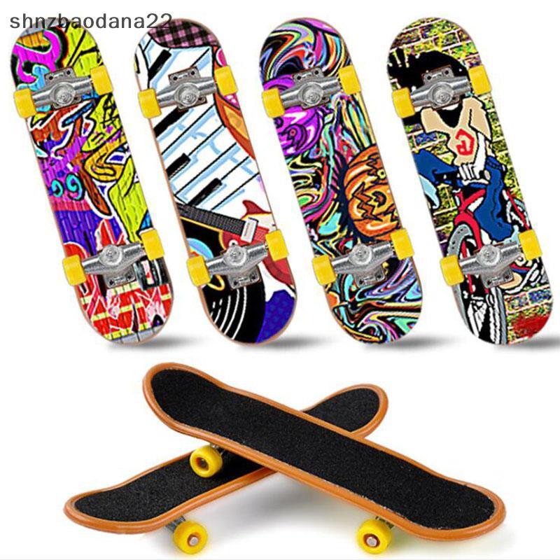 [Shnzd] 1 Pc Bonito Crianças Mini Fingerboard Skate Boarding Presentes Brinquedo De Festa Aleatório EMKK