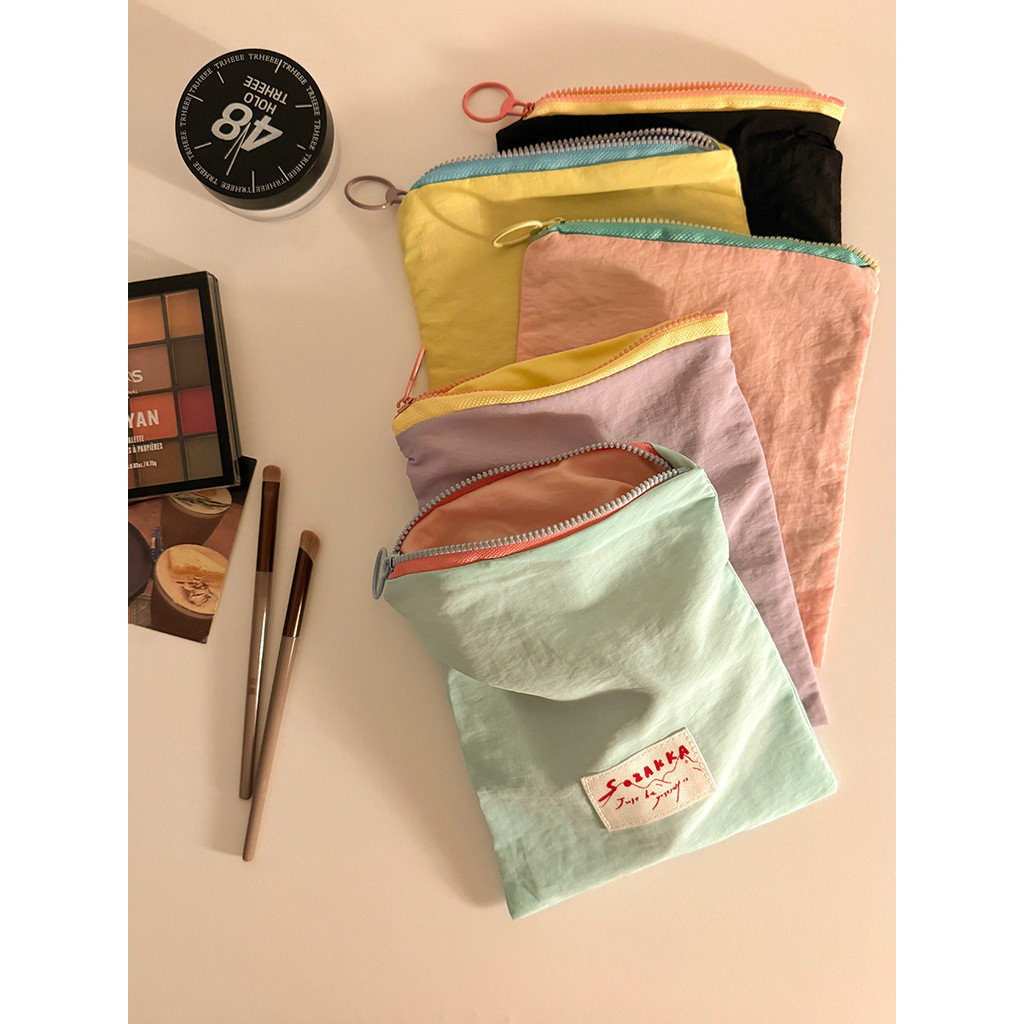Macaron saco cosmético feminino 2026 novo saco de armazenamento portátil guardanapo sanitário Mini pequeno saco moeda bo